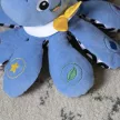 BABY EINSTEIN Zenélő játék polip Octoplush™ 3m+